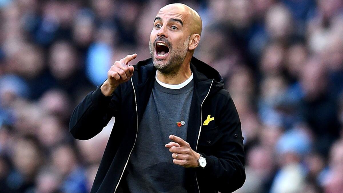 Pep Guardiola yells instructions to his Manchester City players during a Premier League game against Arsenal at Etihad Stadium on Nov. 5.