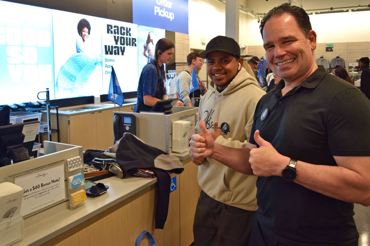 Big Brother John Wolfe shops with his “little,” Jonathan, at the new Nordstrom Rack in San Clemente.