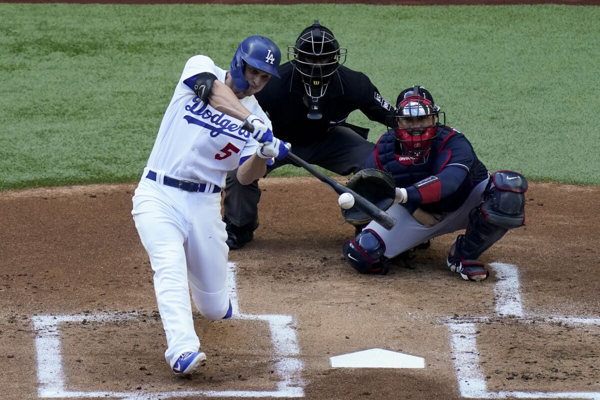 Los Angeles Dodgers' Corey Seager watches his home run against the Atlanta Braves.
