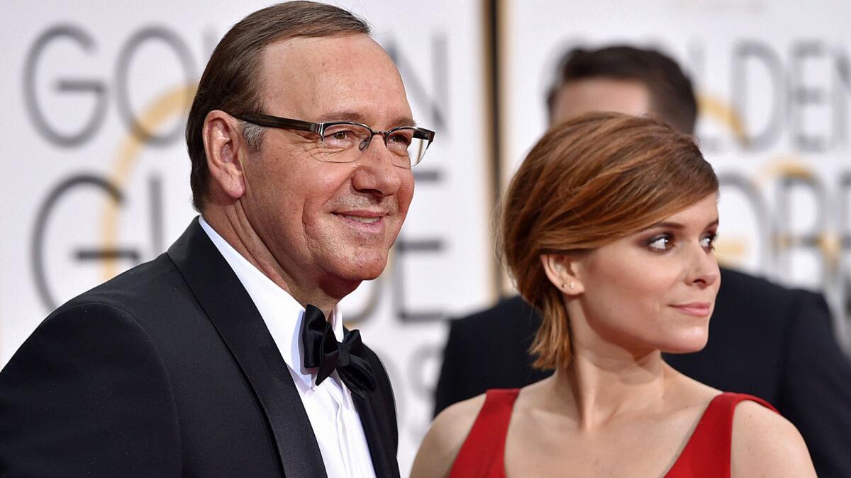 Kevin Spacey, left, and Kate Mara arrive at the 72nd annual Golden Globe Awards at the Beverly Hilton Hotel on Sunday, Jan. 11, 2015, in Beverly Hills, Calif. (Photo by John Shearer/Invision/AP)