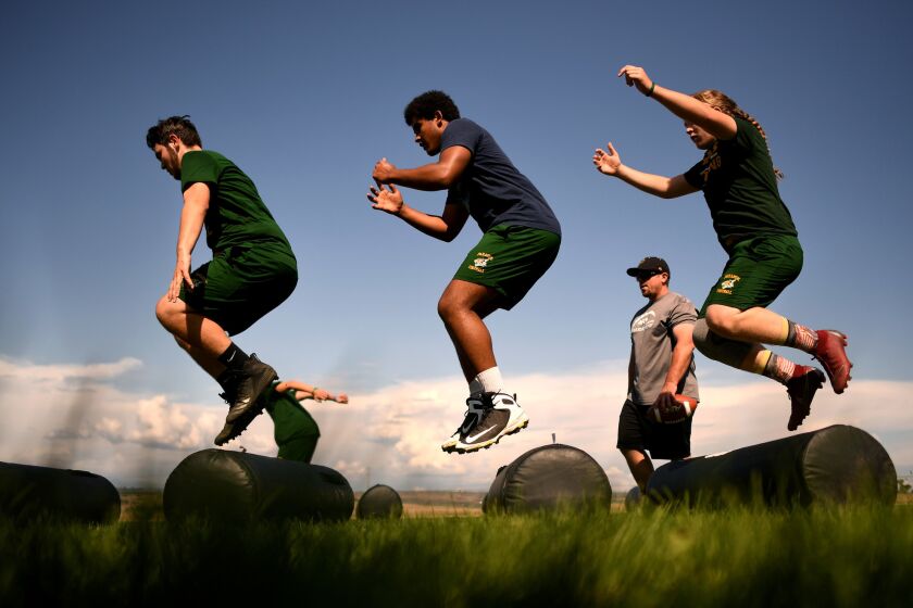 CHICO, CALIFORNIA MAY 28, 2019-Paradise High School football players run drills during practice at Marsh Junior High School in Chico, California. The town of Paradise was devastated by the Camp Fire which destroyed the homes of 97 of the 101 football players. (Wally Skalij/Los Angeles Times)