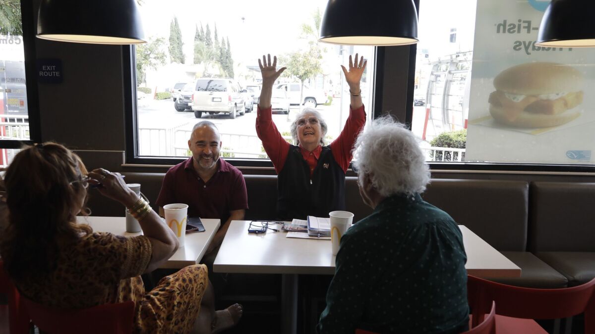 Jackie Goldberg met with campaign supporters Betty Forrester, left, Fidencio Gallardo and Bill Gallegos at a South Gate McDonalds to discuss southeast election strategy. Goldberg is running for LAUSD Board District 5.