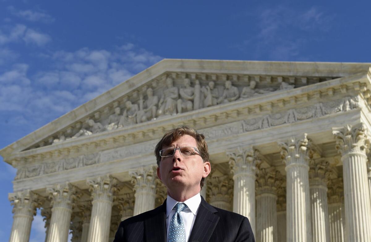 John P. Elwood, attorney for Anthony D. Elonis, who claimed he was kidding when he posted violent comments on Facebook about killing his estranged wife, speaks to reporters outside the Supreme Court in Washington on Monday.