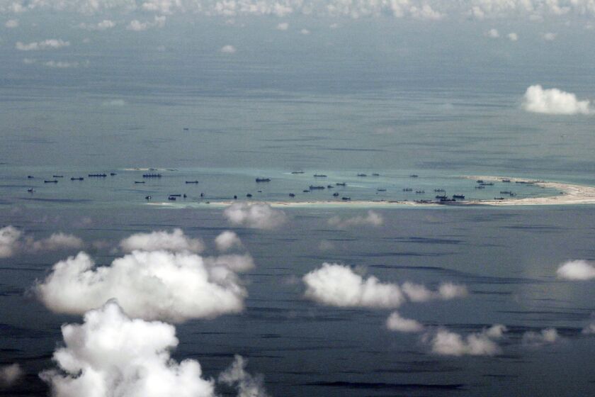 FILE - This May 11, 2015, file photo, shows land reclamation of Mischief Reef in the Spratly Islands in the South China Sea. China has reportedly deployed a Zeppelin-like airship to Mischief Reef in the South China Sea. (Ritchie B. Tongo/Pool Photo via AP, File)
