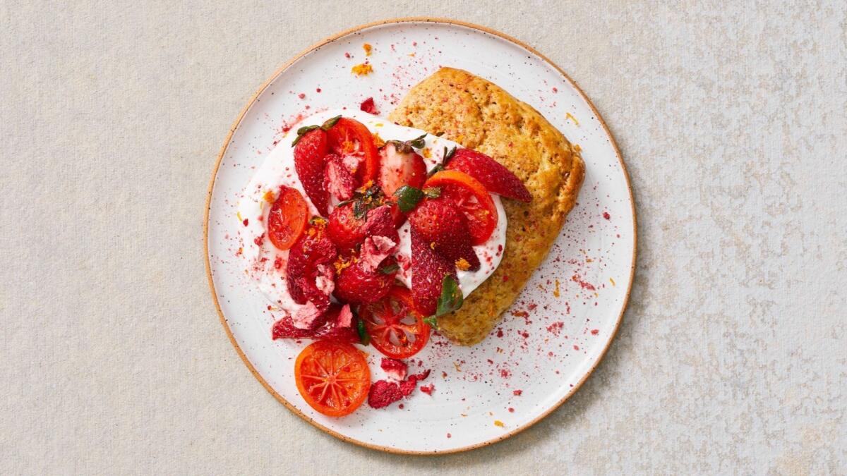 Shortcakes made with rye flour and topped with citrus labneh and a strawberry and mandarinquat compote.