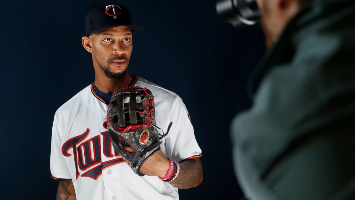 The Twins' Byron Buxton poses for a photographer on the team's media day during spring training baseball, Wednesday, Feb. 21, 2018, in Fort Myers, Fla.