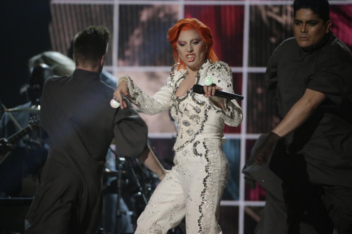 Lady Gaga performs her David Bowie tribute onstage at the 58th Grammy Awards.
