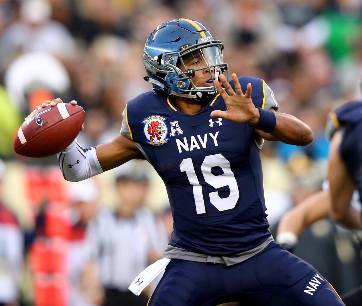 Navy quarterback Keenan Reynolds passes the ball in the first quarter against Army.