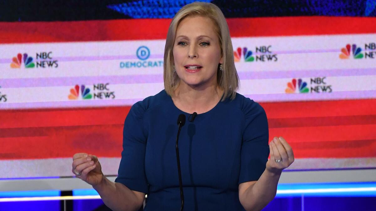 Sen. Kirsten Gillibrand (D-N.Y.) was the only female debater to forego a blazer, opting instead for a tailored dress. (Saul Loeb / AFP/Getty Images)