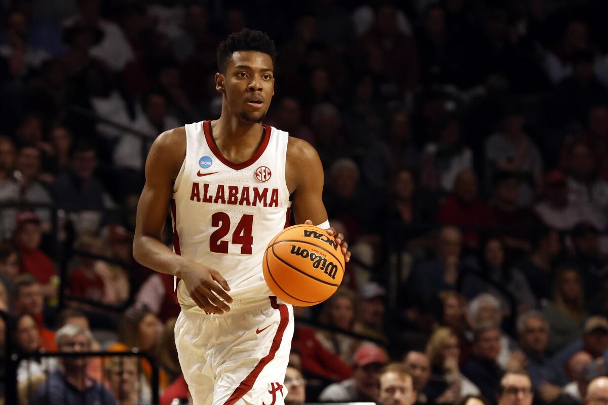 Alabama forward Brandon Miller dribbles in the first half of a second-round college basketball game against Maryland in the NCAA Tournament in Birmingham, Ala., Saturday, March 18, 2023. (AP Photo/Butch Dill)