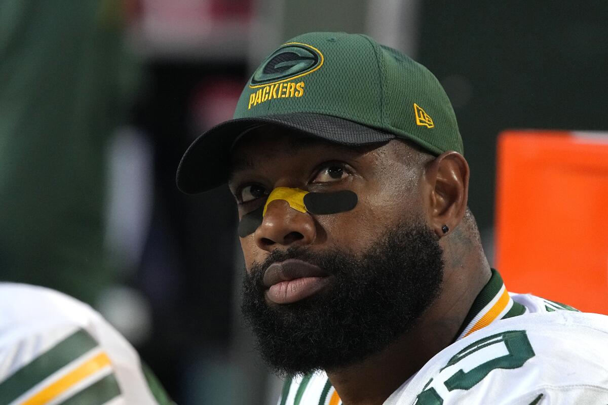 Marcedes Lewis watches a game from the bench while playing for the Packers in 2021.