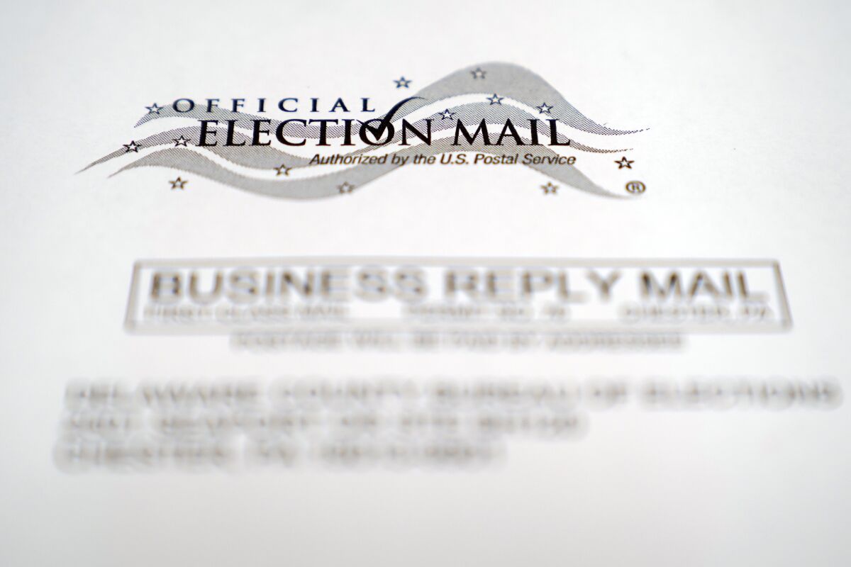 An envelope of a Pennsylvania official mail-in ballot for the 2020 general election is shown, Tuesday, Oct. 13, 2020, in Marple Township, Pa. More than 2.6 million registered Pennsylvania voters have applied for a mail-in ballot as of Tuesday, three weeks before the Nov. 3 presidential election. (AP Photo/Matt Slocum)