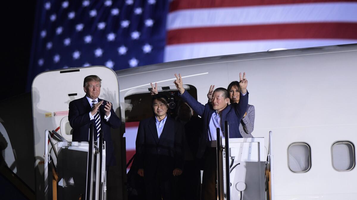 In May, President Trump greets, from left, Tony Kim, Kim Hak Song, seen in the shadow, and Kim Dong Chul, three Americans detained in North Korea for more than a year.