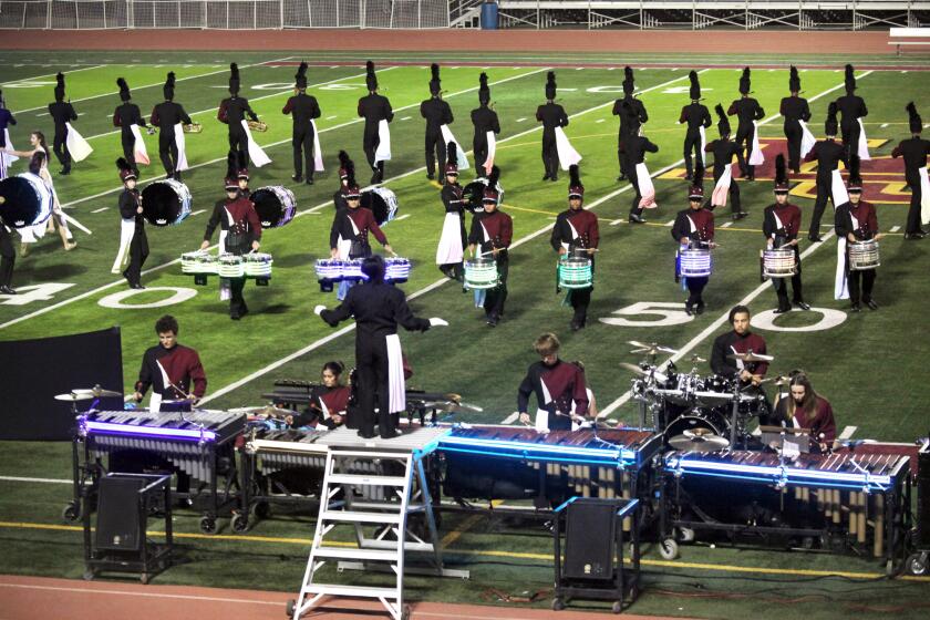 The La Canada High School Marching Spartans perform their 2019 field show "Synethesia: The Color of Sound," an original original art work by Frank Sullivan that explores the connection of sight and sound, at the La Canada High School football field in La Canada Flintridge, Ca., Friday, November 22, 2019. (photo by James Carbone)