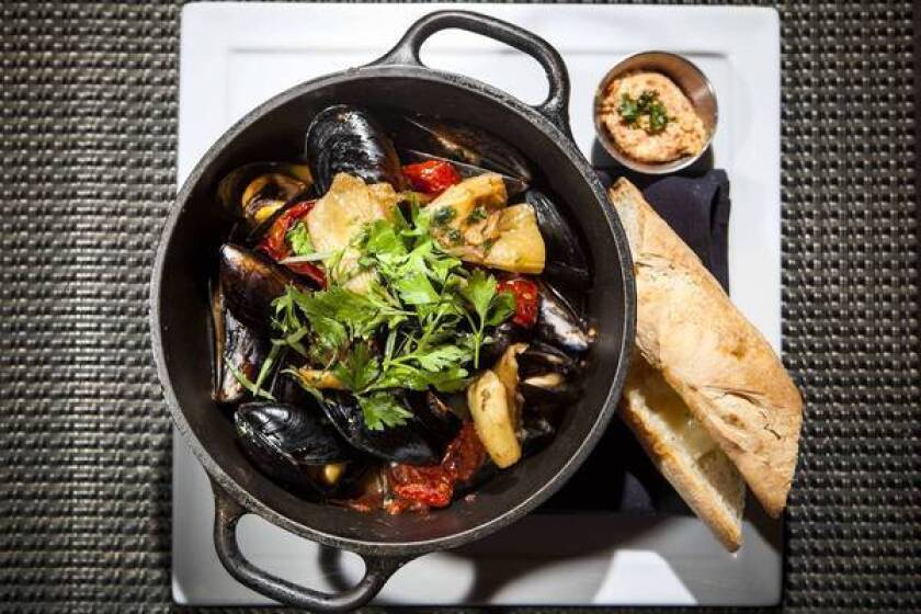 From Industriel's dinner menu: mussels, absinthe-spiked bouillabaisse broth, rouille, gruyere and baguette. $19.