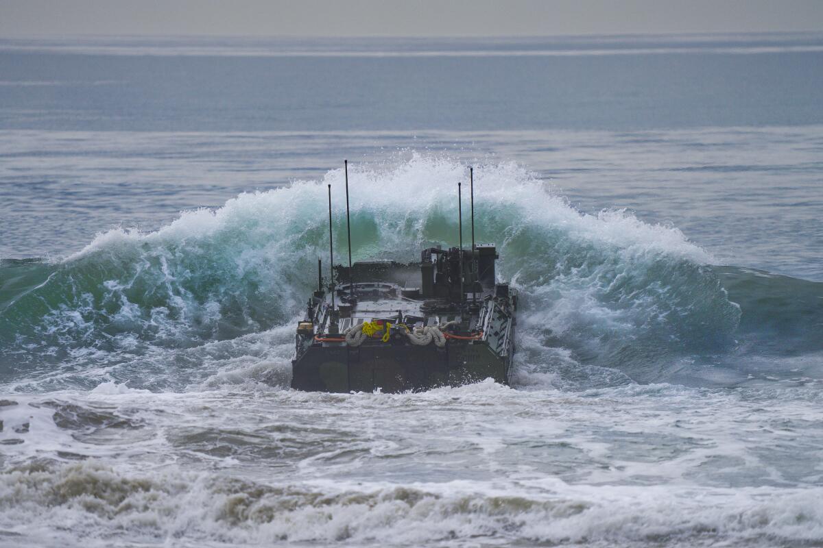 Marines from the 3rd Assault Amphibian Battalion in their Amphibious Combat Vehicle at Camp Pendleton