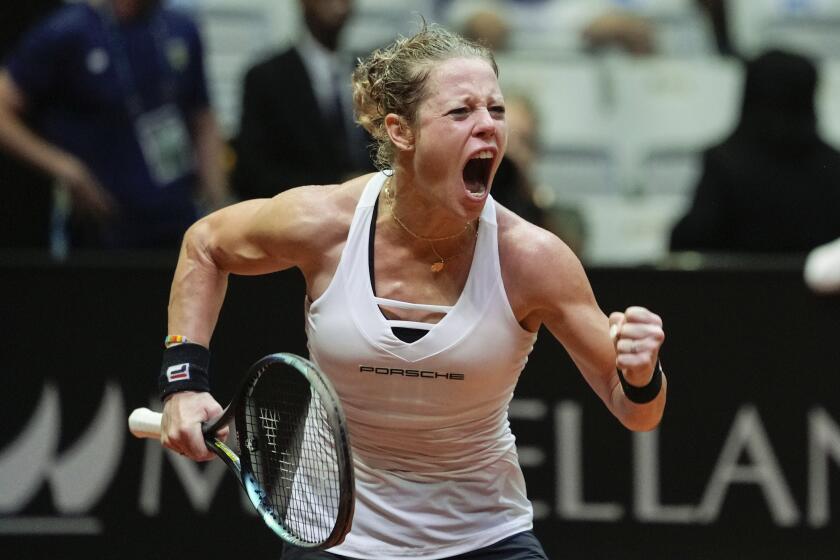 Laura Siegemund of Germany celebrates after defeating Carolina Alves of Brazil during their Billie Jean King Cup tennis match in Sao Paulo, Brazil, April 13, 2024. (AP Photo/Andre Penner)