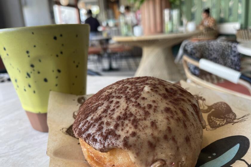A caffeinated beverage and tiramisu stuffed doughnut from Dodo Bird Donuts in Bird Rock.