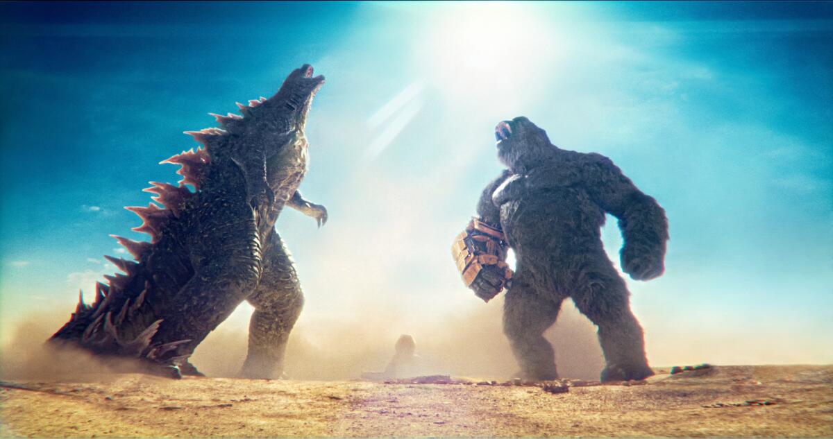 Two giant monsters unite and roar.