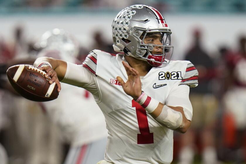 Ohio State quarterback Justin Fields passes against Alabama during the second half of an NCAA College Football Playoff.