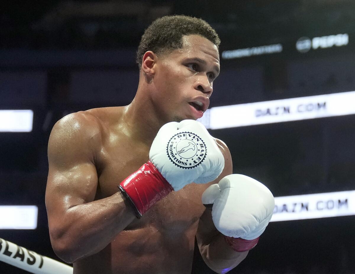 FILE - Devin Haney fights Regis Prograis duri
