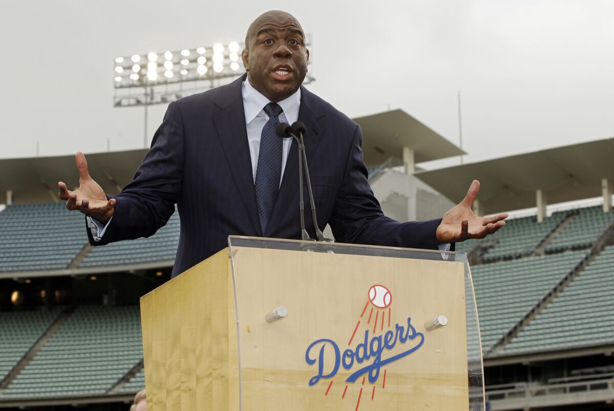 Magic Johnson speaks during a news conference at Dodger Stadium.