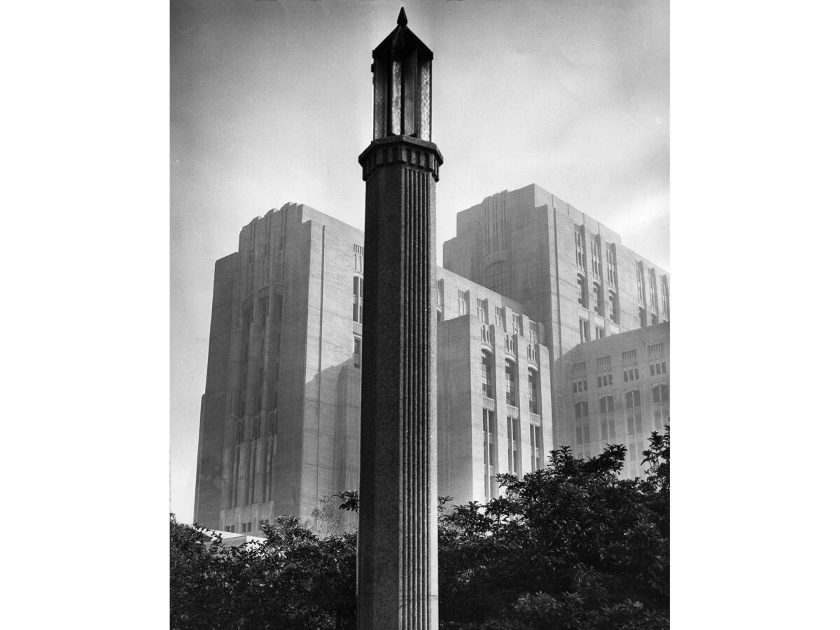 A street lamp dominates the foreground of this November 1955 photo of Los Angeles County General Hospital.