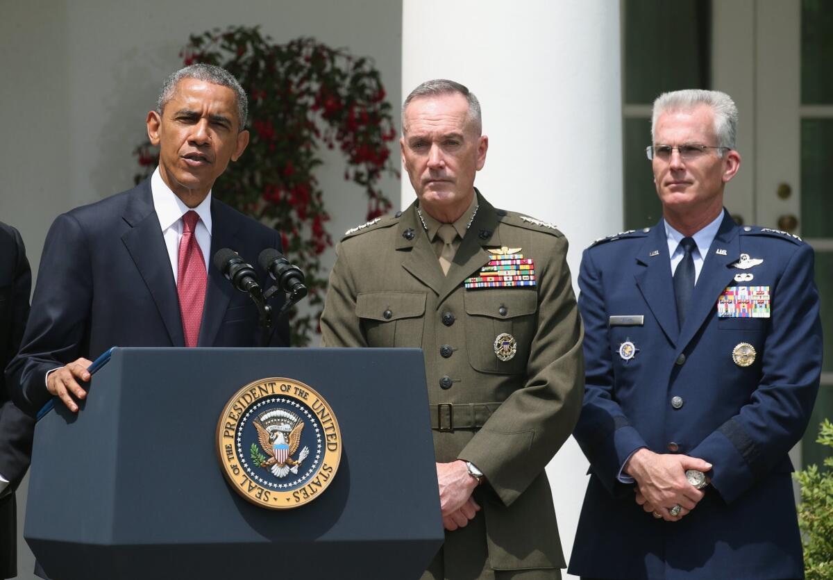 President Obama nominates Marine Gen. Joseph Dunford Jr. (center) to be the next chairman of the Joint Chiefs of Staff, and U.S. Air Force Gen. Paul J. Selva to be vice chairman, during an event in the Rose Garden of the White House on May 5.