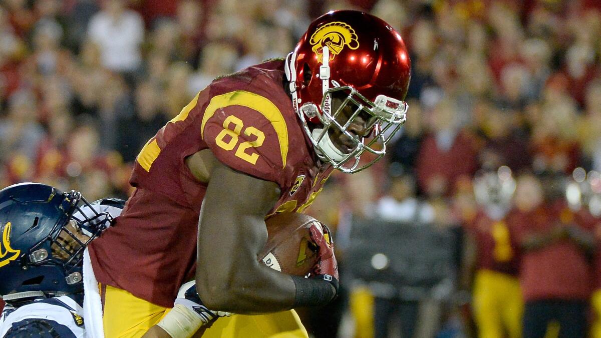 USC tight end Randall Telfer is tackled after making a catch against California on Nov. 13.