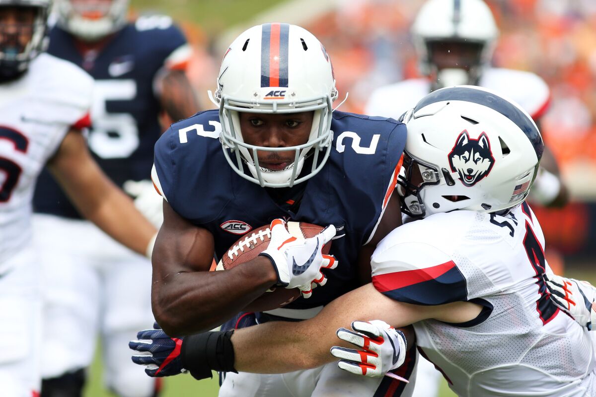 Virginia's Joe Reed carries the ball against Connecticut in September 2017.