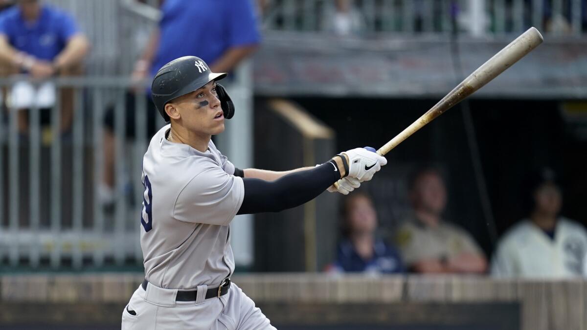 New York Yankees' Aaron Judge hits a three-run home run against the Chicago White Sox.
