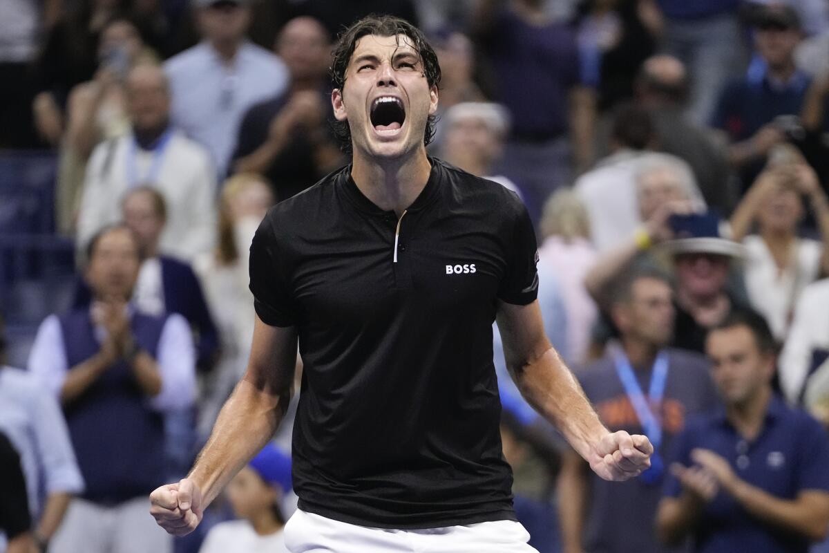 Taylor Fritz celebrates after defeating Frances Tiafoe in the U.S. Open semifinals on Friday night.