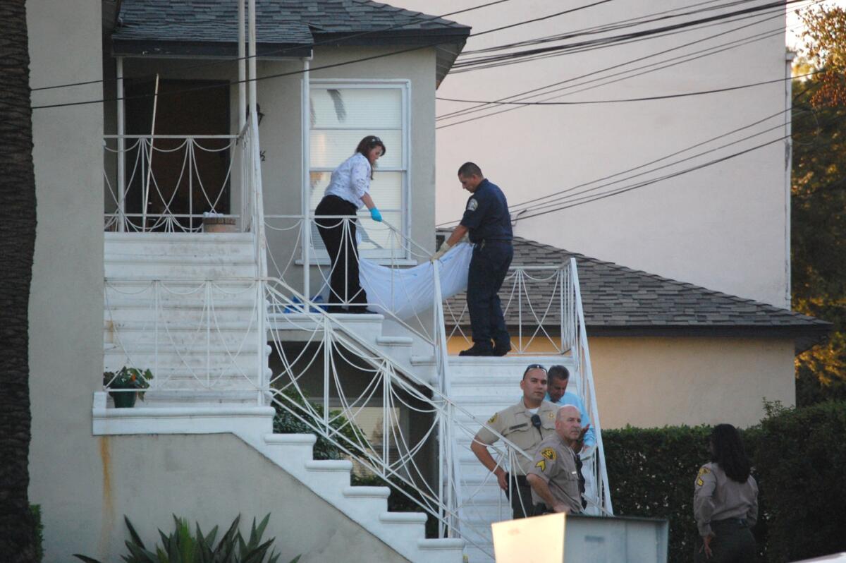 Los Angeles County Coroners officials removed a body from an apartment in the 4500 block of Lasheart Drive on Oct. 17, 2009. A man and a woman were found shot to death in the apartment, an apparent murder-suicide.