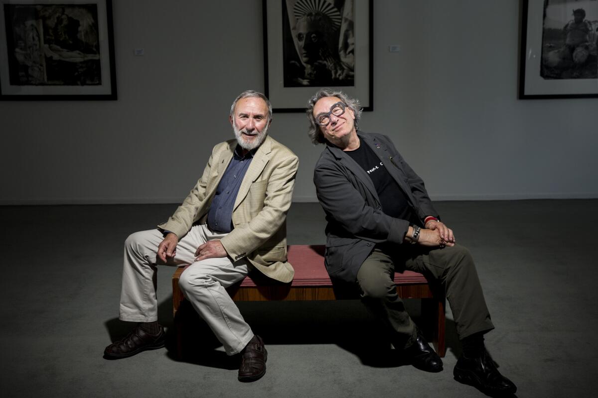 Jerome Witkin, left, and his identical twin, Joel-Peter Witkin, are photographed at Jack Rutberg Fine Arts, the L.A. gallery showing the brothers' first joint exhibition of photography and painting.
