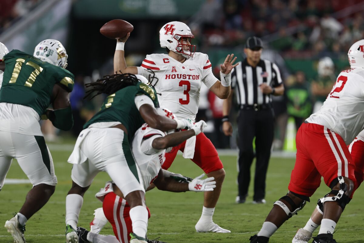 Houston's quarterback Clayton Tune throws a pass against South Florida during the first half of an NCAA college football game Saturday, Nov. 6, 2021, in Tampa, Fla. (AP Photo/Scott Audette)