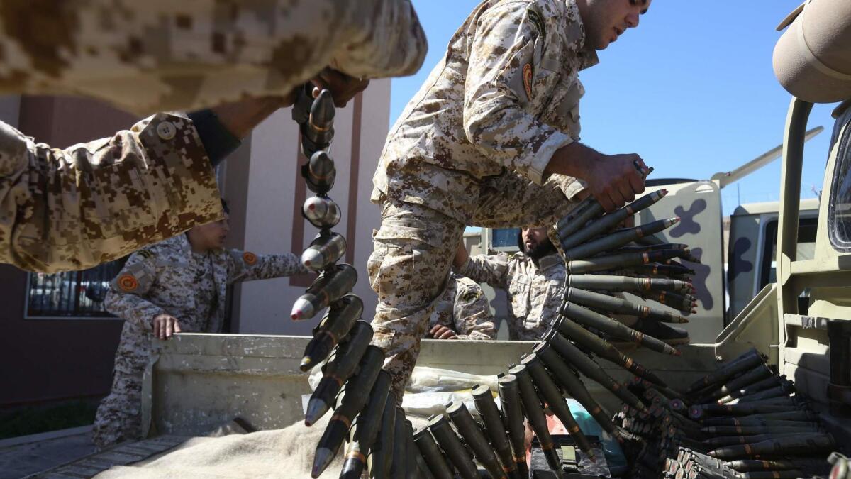 Fighters loyal to the U.N.-backed government prepare for battle on April 8, 2019, against the forces of Libyan warlord Khalifa Haftar in Tripoli.