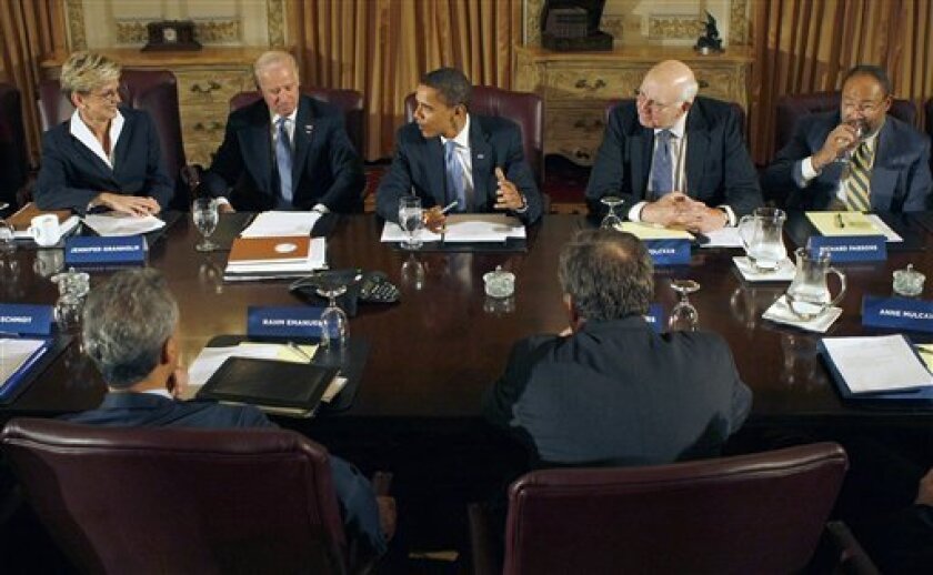President-elect Obama, center, meets with his economic advisory team in Chicago, Friday, Nov. 7, 2008. Facing camera, from left are, Michigan Gov. Jennifer Granholm, Vice President-elect Joe Biden, former Federal Reserve Chairman Paul Volcker and Time Warner Chairman Richard Parsons. Back to camera, from left are, White House Chief of Staff-designate Rahm Emanual and Google CEO Eric Schmidt. (AP Photo/Pablo Martinez Monsivais)