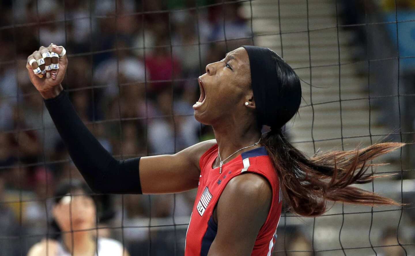Team USA's Destinee Hooker reacts after scoring a point against South Korea during a women's volleyball semifinal match. The U.S. defeated the Koreans in straight sets to earn a spot in the gold-medal match.