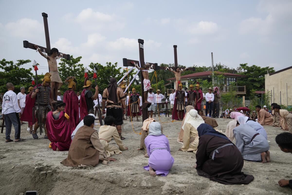 Men nailed to crosses are part of a reenactment of Jesus Christ's sufferings in the Philippines.