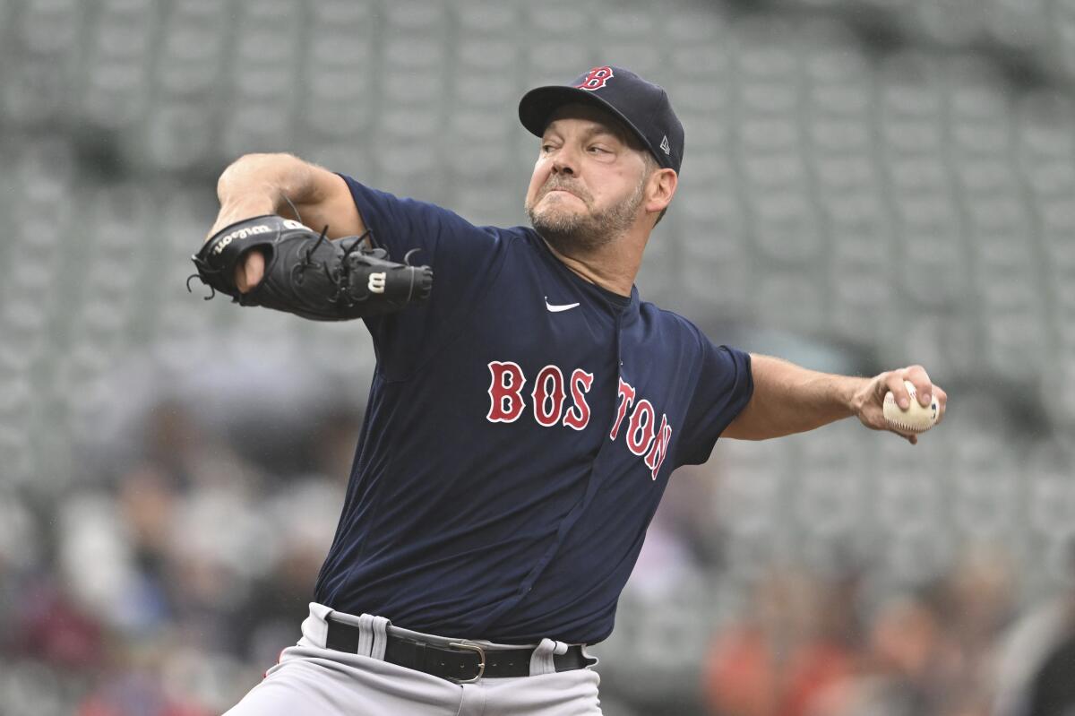 Boston Red Sox pitcher Rich Hill delivers against the Baltimore Orioles in the first inning of a baseball game, Sunday, Sept. 11, 2022, in Baltimore. (AP Photo/Gail Burton)