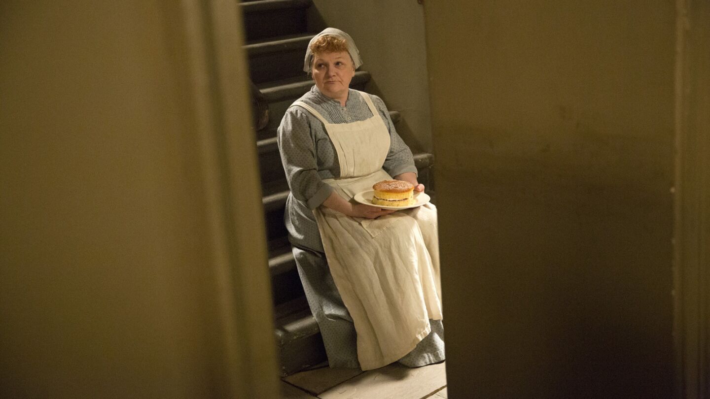 Lesley Nicol waits for a take to start during filming of a scene of "Downton Abbey" in the downstairs servant's quarters set at Ealing Studios in West London.