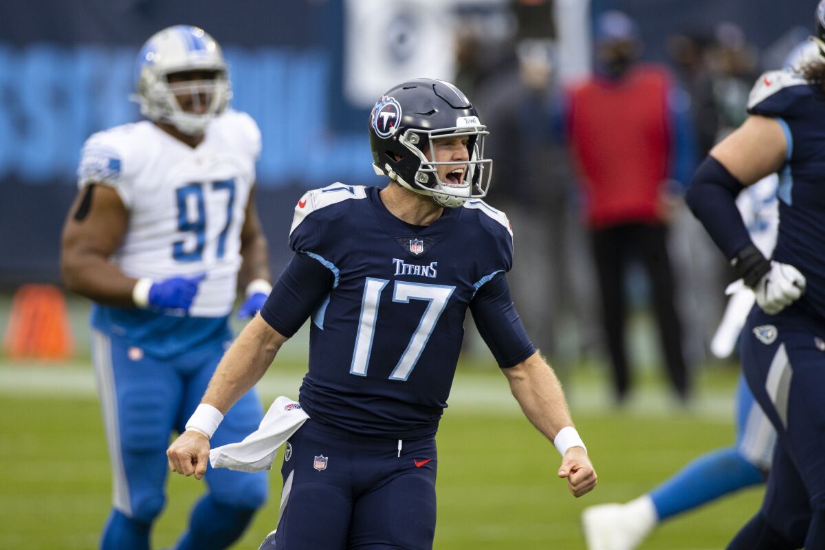 Tennessee Titans quarterback Ryan Tannehill celebrates a touchdown pass against the Detroit Lions.