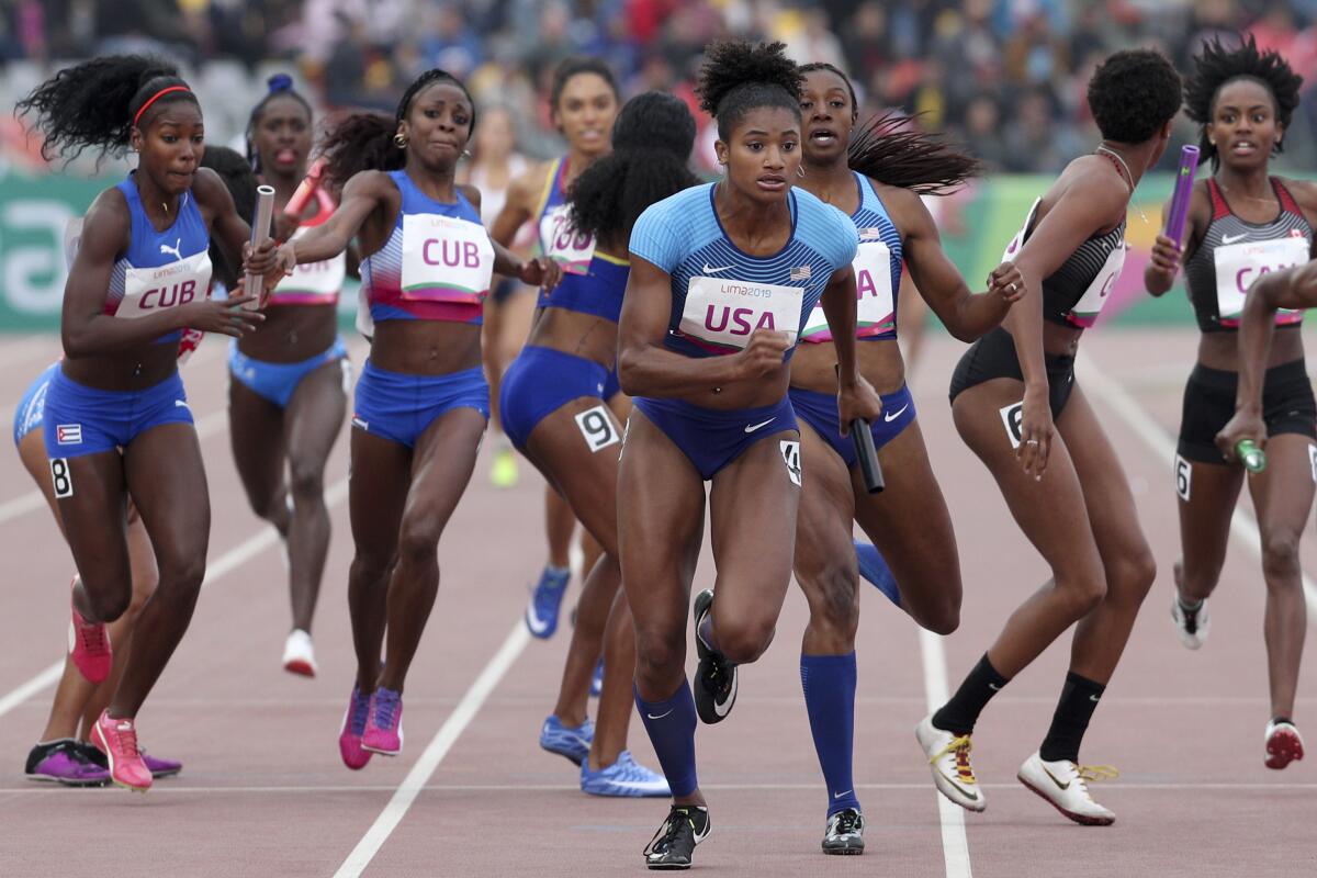 Anna Cockrell begins running after taking the baton in the 1,600-meter relay final at the 2019 Pan American Games in Peru.