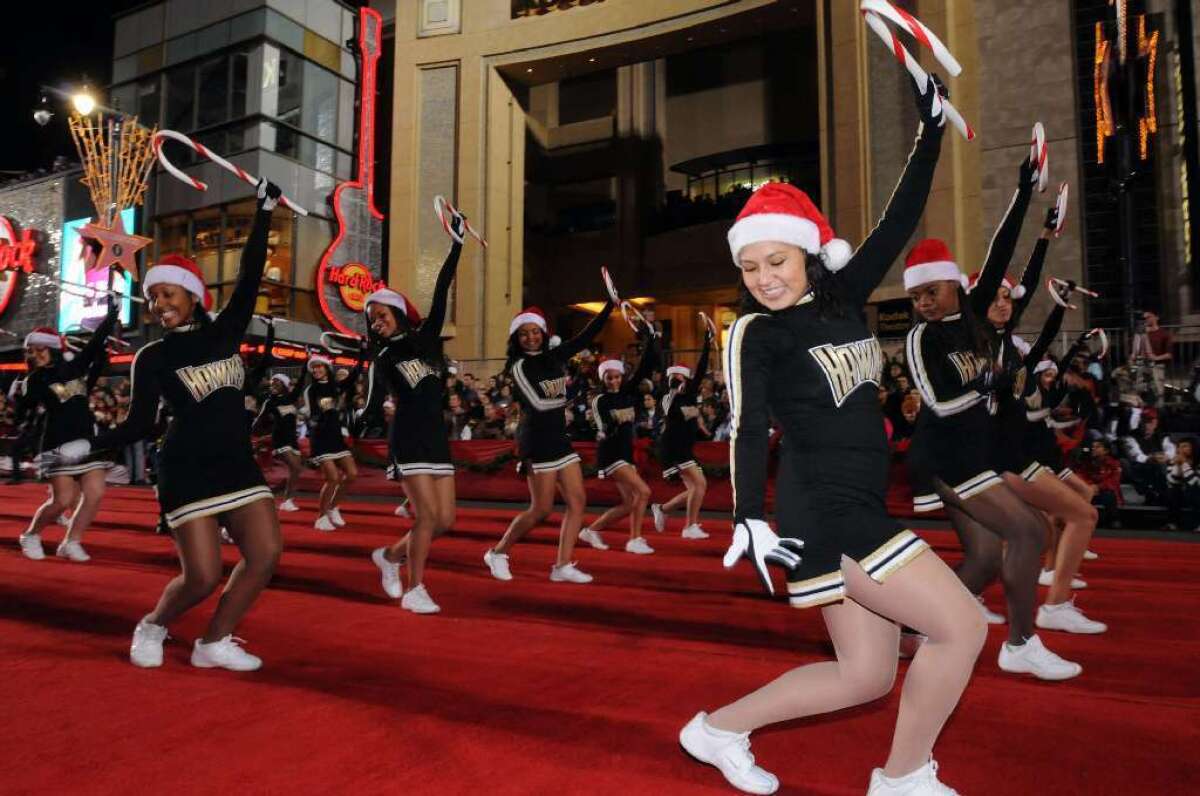 The drill team from Pete Knight High School in Palmdale takes its turn on the read carpet in the 2009 Hollywood Christmas Parade.