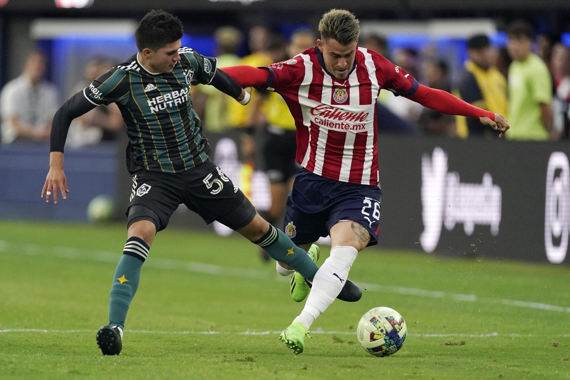 Los Angeles Galaxy forward Jonathan Perez, left, and