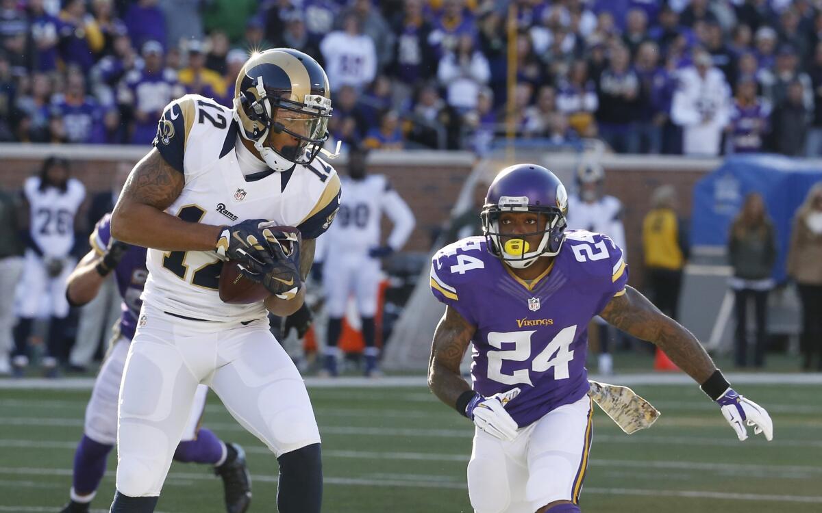 Rams receiver Stedman Bailey catches a pass in front of Vikings cornerback Captain Munnerlyn during the second half of a game on Nov. 8.