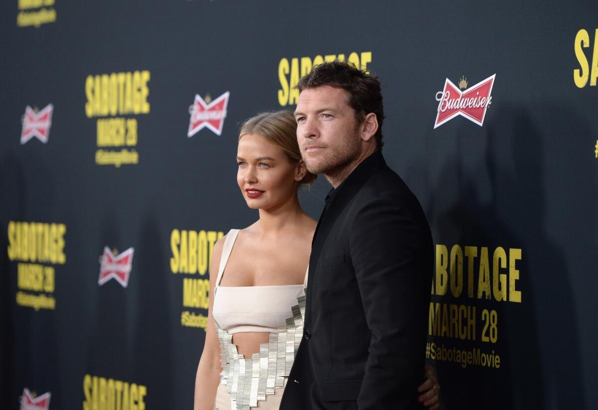 Sam Worthington, right, has reportedly reached a conditional agreement in his paparazzi assault case.