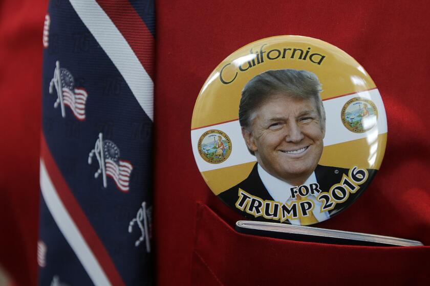 A Donald Trump supporter wears a button featuring the candidate before the California Republican Party 2016 Convention in Burlingame, Calif., on April 29.