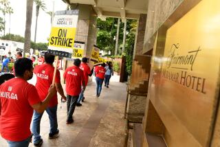 Santa Monica, California July 3, 2023-Hotel workers protest outside the Fairmont Miramar Hotel in Santa Monica Monday. Workers at dozens of major Southland hotels remain on strike in an effort to secure higher pay and improvements in healthcare and retirement benefits. (Wally Skalij/Los Angles Times)