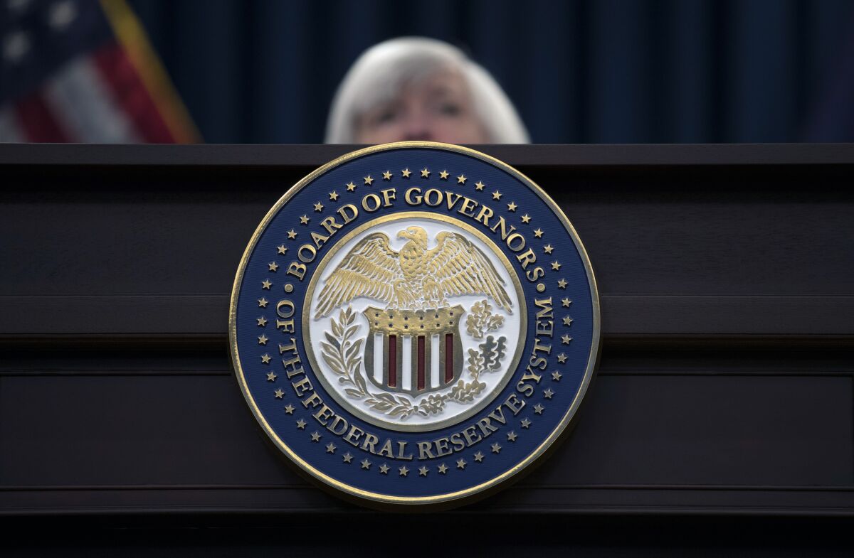 FILE - The seal of the Board of Governors of the United States Federal Reserve System is displayed on the desk as Federal Reserve Chair Janet Yellen speaks during a news conference following the Federal Open Market Committee meeting in Washington, Wednesday, Dec. 13, 2017. The Federal Reserve Board has denied a Wyoming cryptocurrency bank's application for Federal Reserve System membership, officials announced Friday, Jan. 27, 2023, a setback for the crypto industry's attempts to build acceptance in mainstream U.S. banking. (AP Photo/Carolyn Kaster, File)